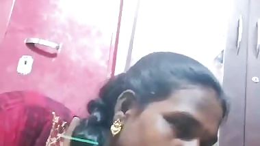 Mature tattooed Tamil wife giving handjob to husband